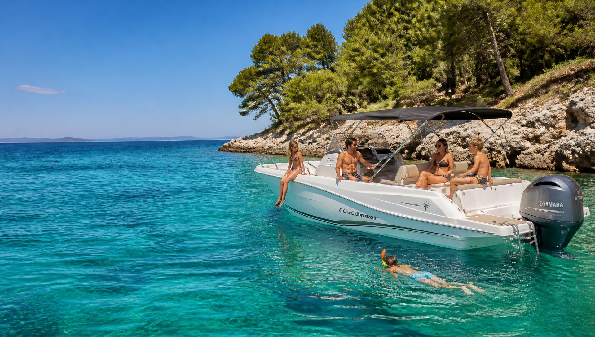 Family and friends on a small day boat anchored in a clear turquoise Croatian cove with children snorkelling
